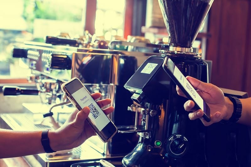 bigstock-Customer-Hand-Using-Smart-Phon-447148249