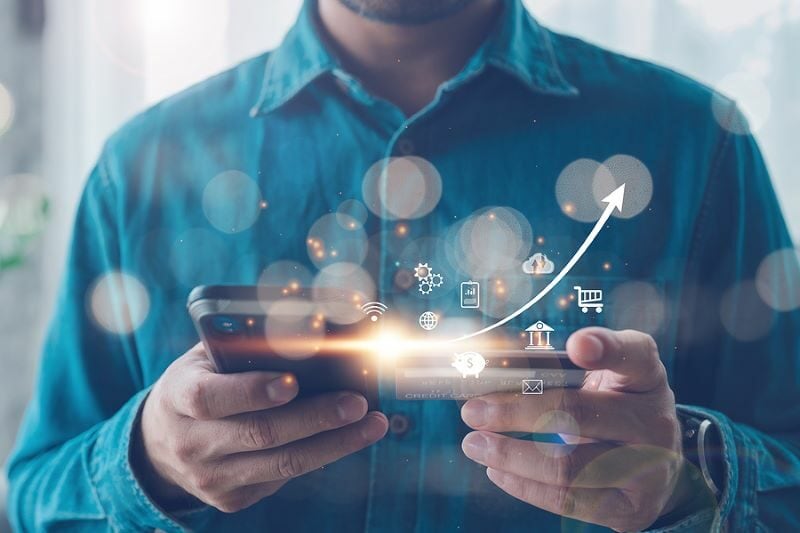 bigstock-Man-Using-Mobile-Online-Bankin-431804915